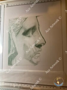 A colour pencil drawing of a side view of the face of a statue on a pale background. The image is watermarked with a logo, copyright symbol and the following text: Ace Artwork ©